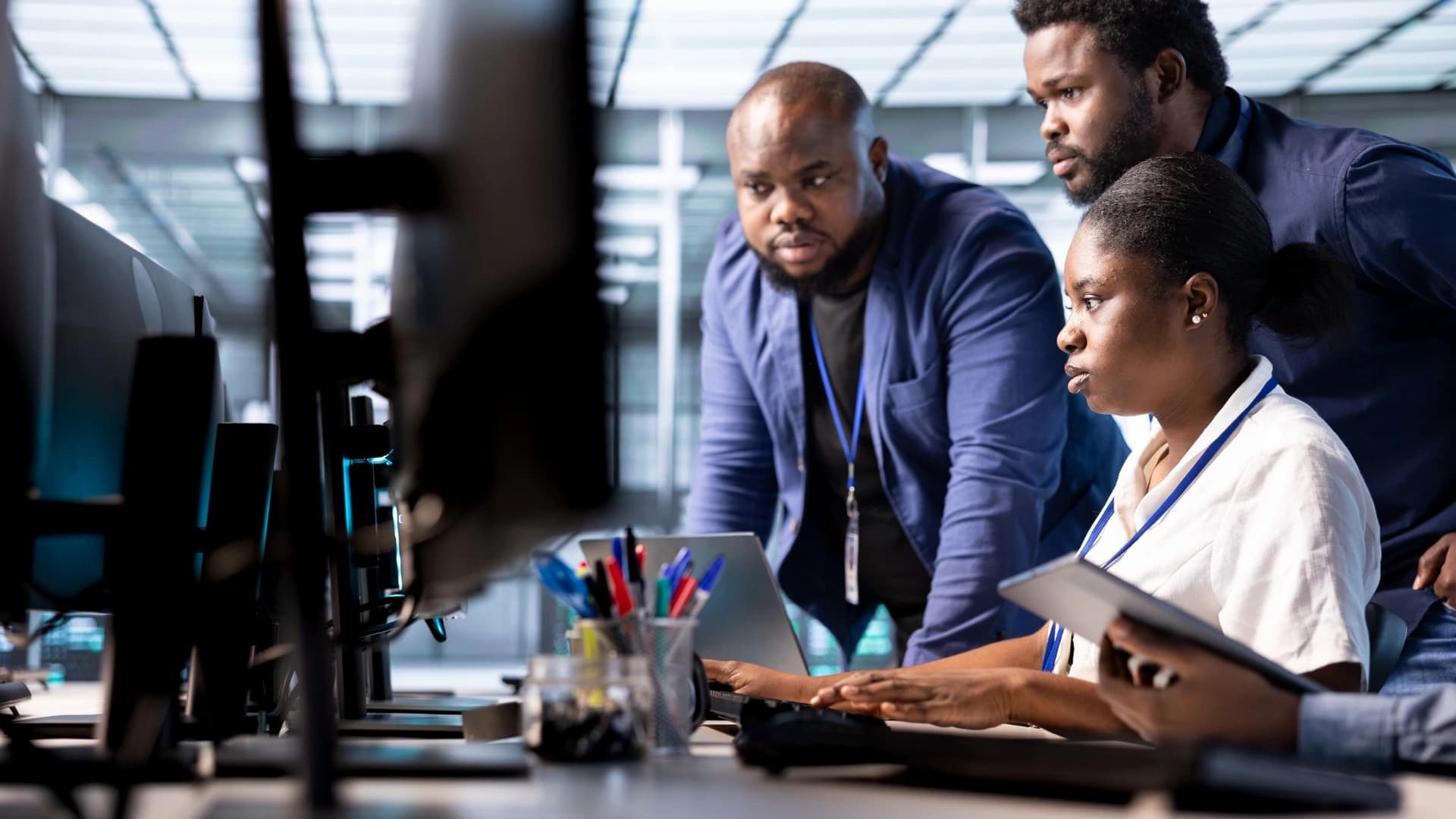 Business team collaborating at computers